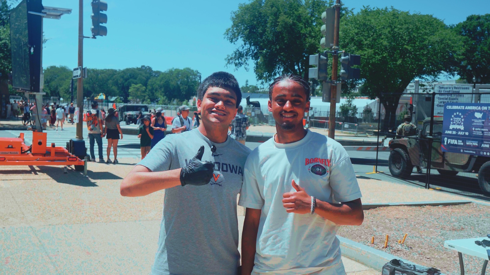 Omeed and a client smiling after a haircut